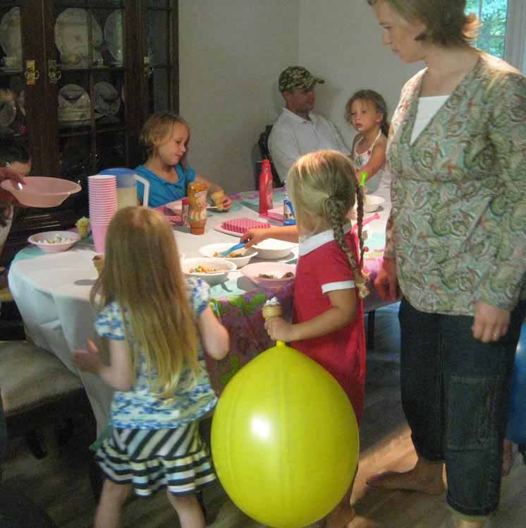 Children around a table for a party